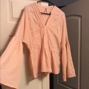 Blush peplum top bell sleeves